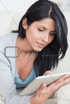 Close up of a woman holding a tablet