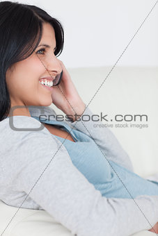 Smiling woman with a phone in her hand
