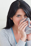 Close-up of a woman drinking from a mug