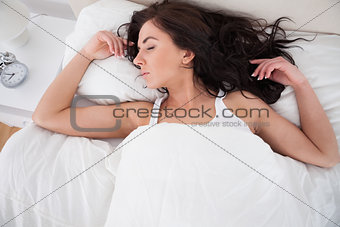 Woman sleeping in her bed in the morning