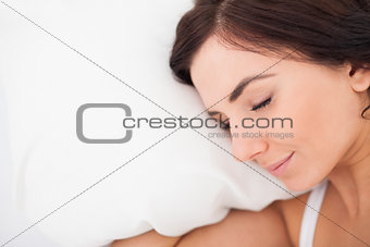 Peaceful brown-haired woman resting