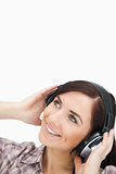 Woman enjoying music with headphones while looking up