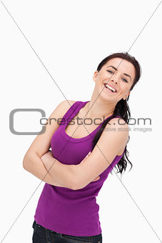 Laughing woman with folded arms