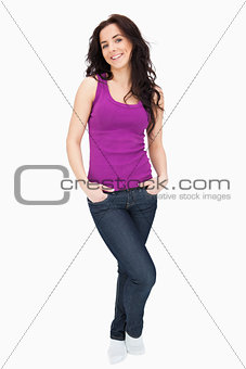 Young woman smiling the hand in her pockets