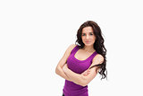 Brunette with arms crossed in purple tank top