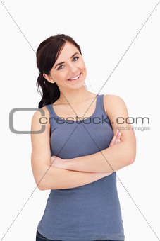 Young woman with folded arms