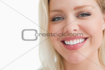 Smiling blonde woman staring at the camera