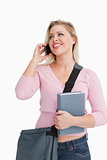 Smiling woman looking away while talking on the phone
