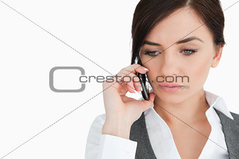 Upset blue eyed businesswoman on the phone