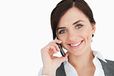 Happy businesswoman using a phone
