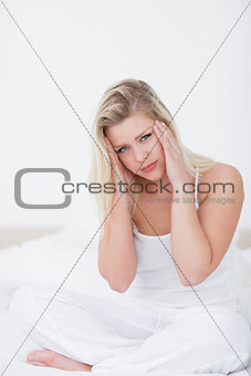 Blonde massaging her foreground while sitting