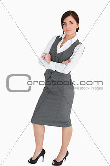 Seductive woman in suit posing with arms folded