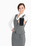 Attractive businesswoman showing her smartphone screen