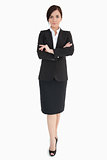 Woman in black suit with folded arms