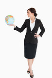 Attractive businesswoman holding an earth globe