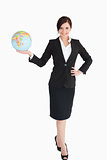 Happy businesswoman holding an earth globe