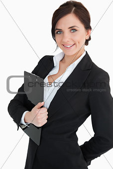 Happy businesswoman holding a clipboard