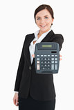 Businesswoman in black suit showing a calculator