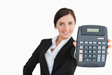 Woman in black suit showing a calculator