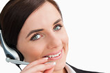 Smiling woman in suit using a headset