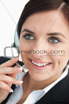 Happy businesswoman using a headset