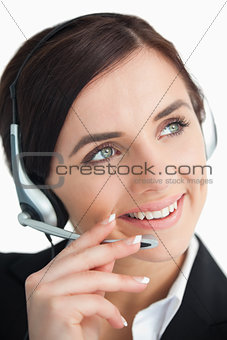 Pretty businesswoman using a headset