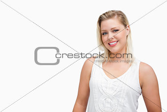 Smiling blonde woman standing upright