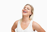 Happy woman laughing with her hands on her hips