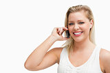 Smiling blonde woman holding a cellphone
