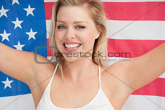 Cheerful woman holding the American flag