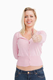 Joyful woman placing her thumbs up