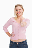 Woman standing upright while placing her thumbs up