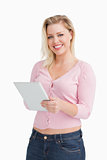 Smiling woman holding her tablet computer