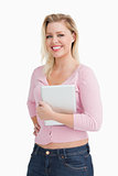 Attractive woman proudly holding her tablet computer