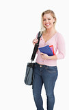 Happy blonde woman holding notebooks