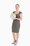 Businesswoman holding a globe in her hands
