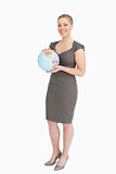 Businesswoman holding a globe 