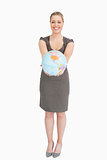Businesswoman showing a globe 