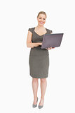 Woman smiling holding a laptop