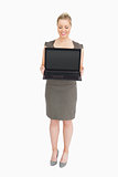 Businesswoman showing a laptop