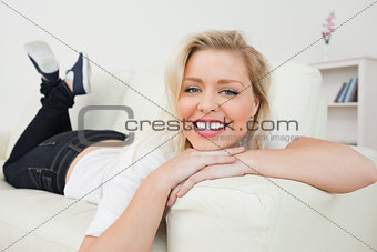 Woman smiling while lying down
