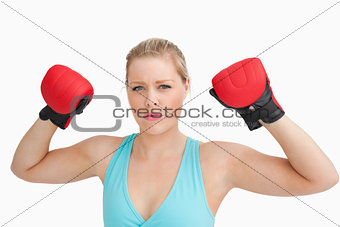 Woman showing boxing gloves