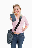 Happy blonde woman showing her smartphone