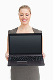 Woman showing a laptop screen