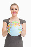 Woman showing a globe 