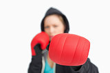 Woman fuzzy showing a boxing glove