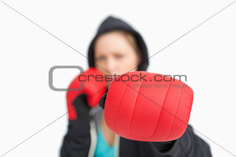 Woman fuzzy showing a boxing glove