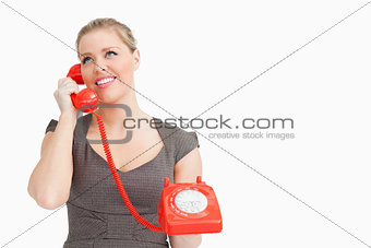 Woman calling with someone at a phone