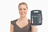 Woman showing a calculator in her hand