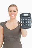 Smiling woman showing a calculator
